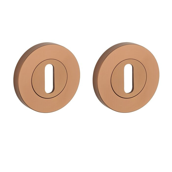 Türgriffe 1743 auf runder Rosette | ROBUST | Kupfer PVD