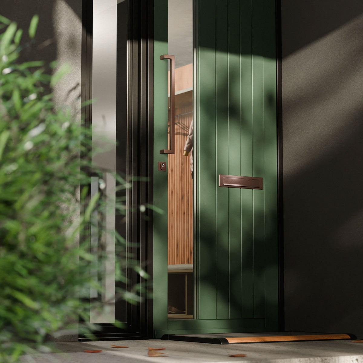 Voordeur met verkropte deurgreep en briefplaat in Bronze blend